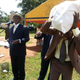 Image for article titled Ugandan president Yoweri Museveni hands out $100K in a sack full of cash